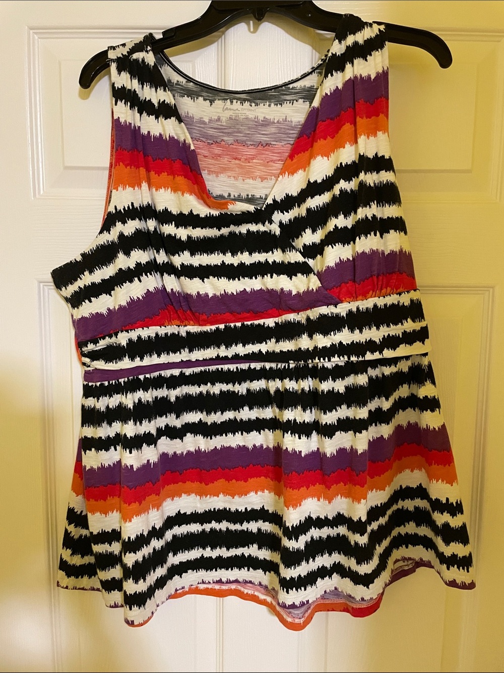 Striped V-Neck Sleeveless Peplum Top in Black, White, Purple & Orange
